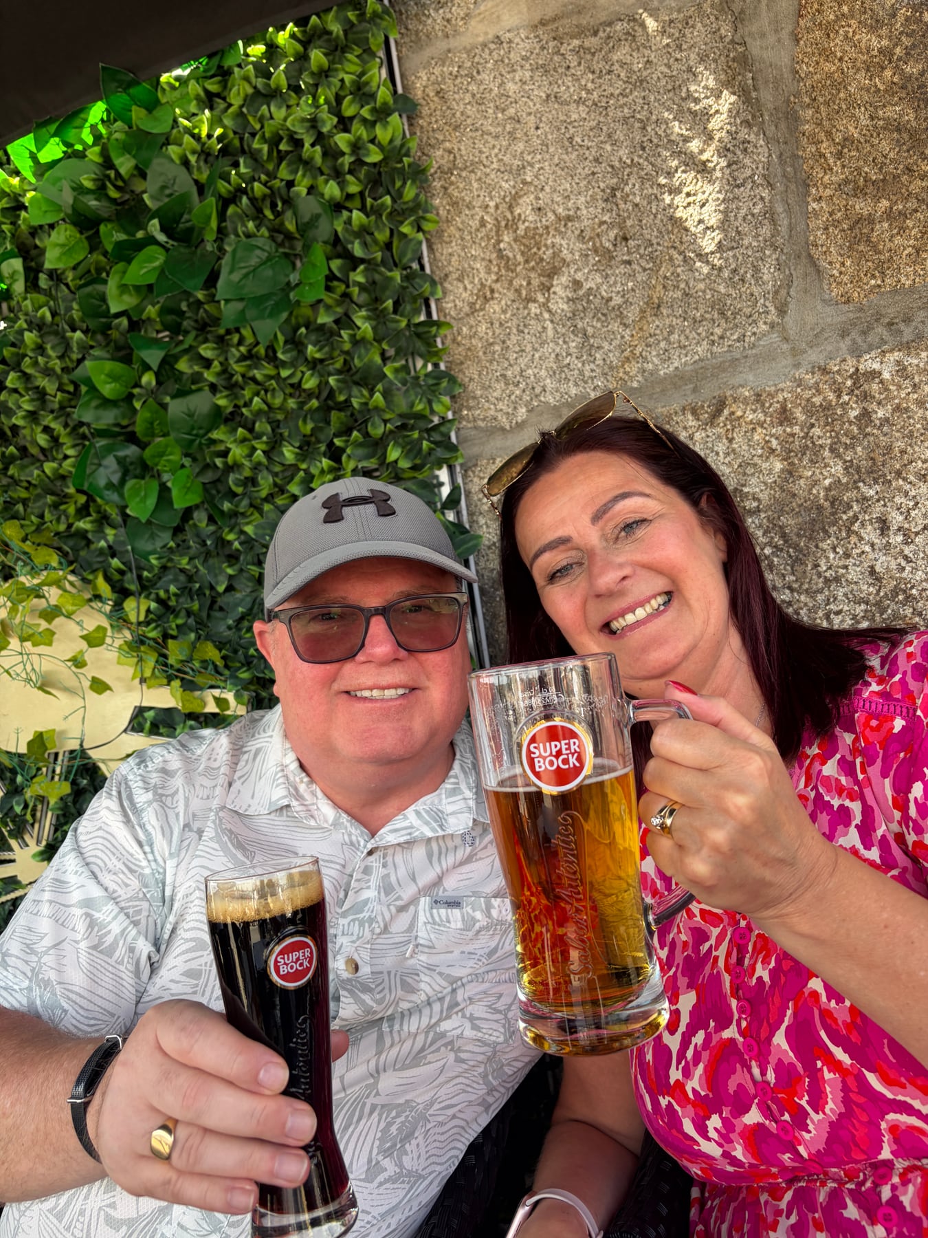 Chris and Sarah raising drinks together in Porto