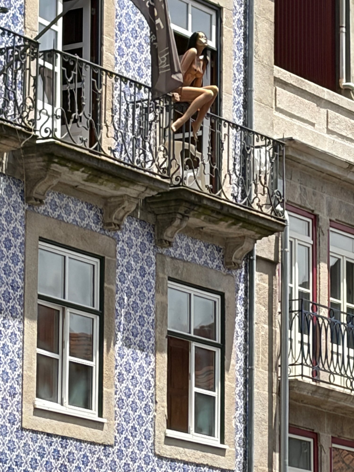 Blue patterned tiles and iron balconies in Porto's Ribeira neighbourhood
