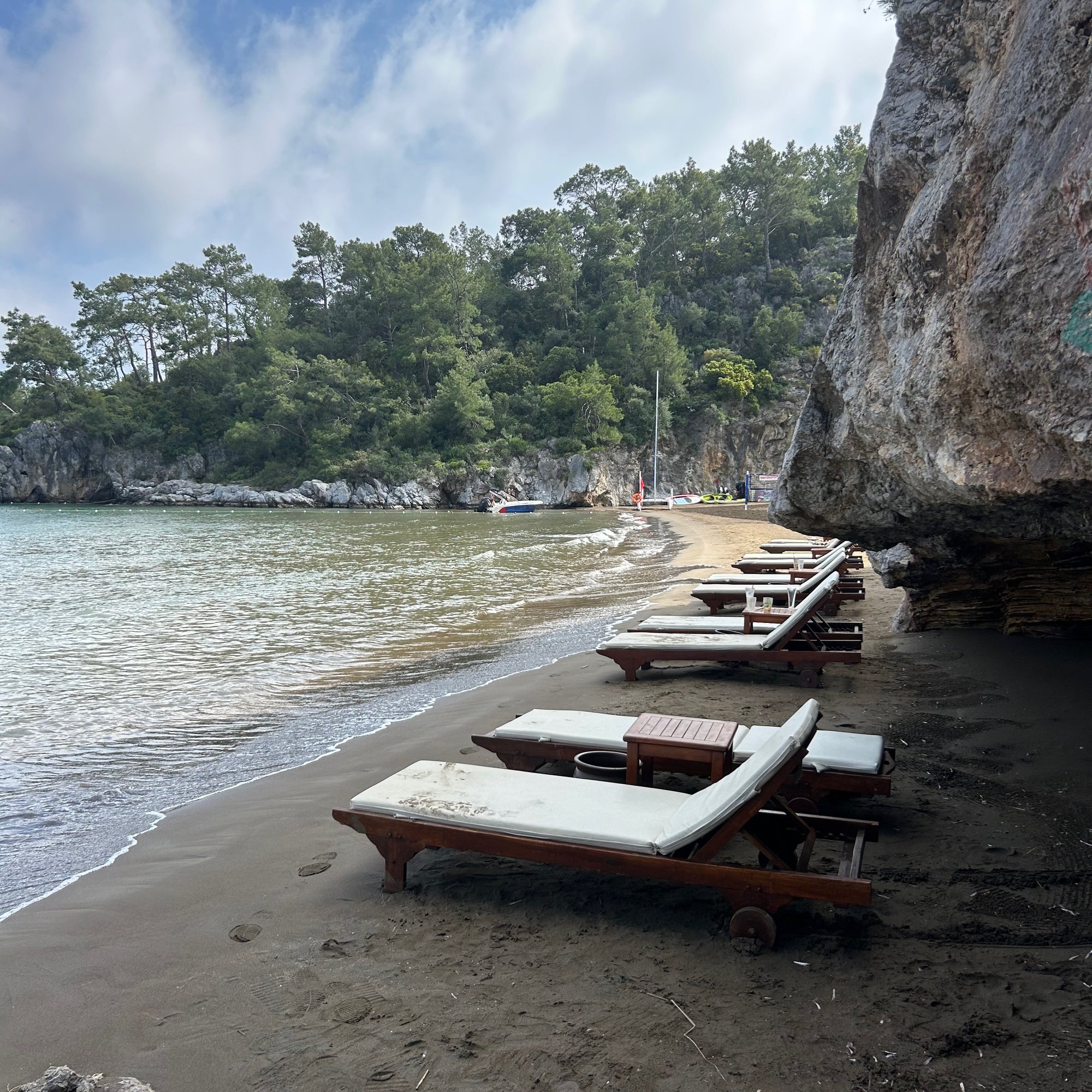 The quiet cove and sunbeds below TUI BLUE Seno