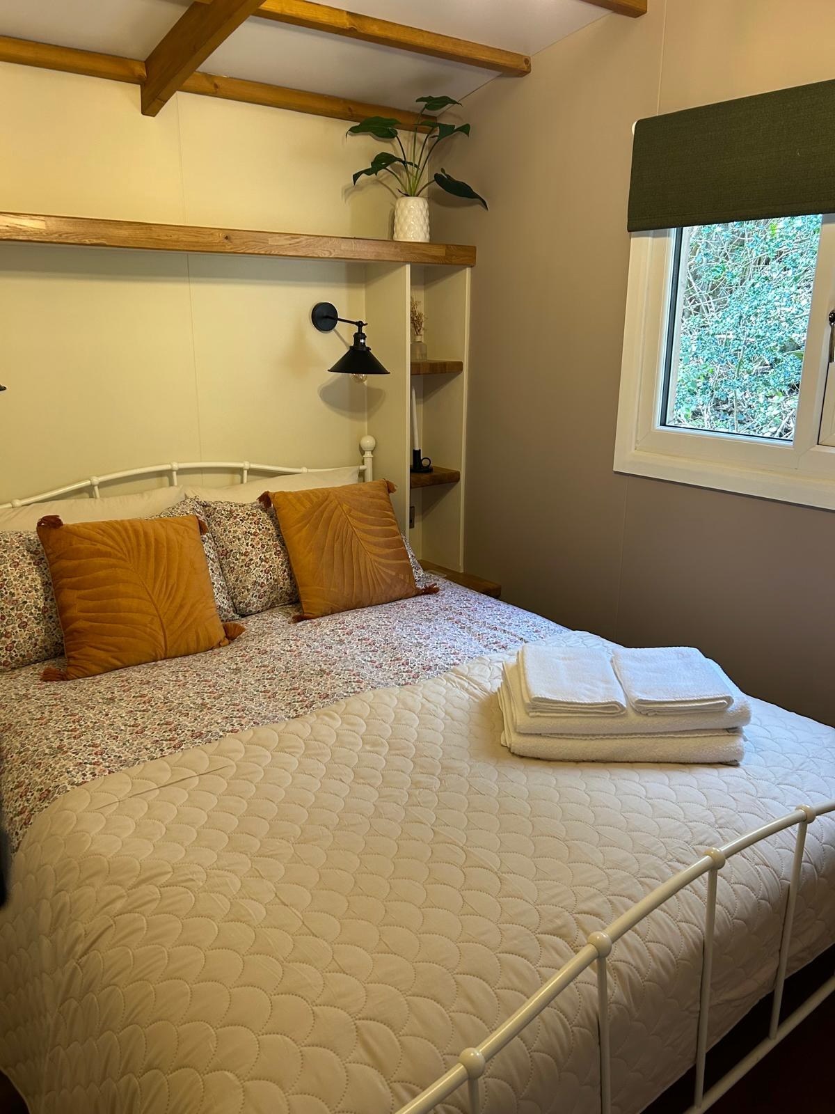 The neatly prepared bedroom inside Sycamore Cabin