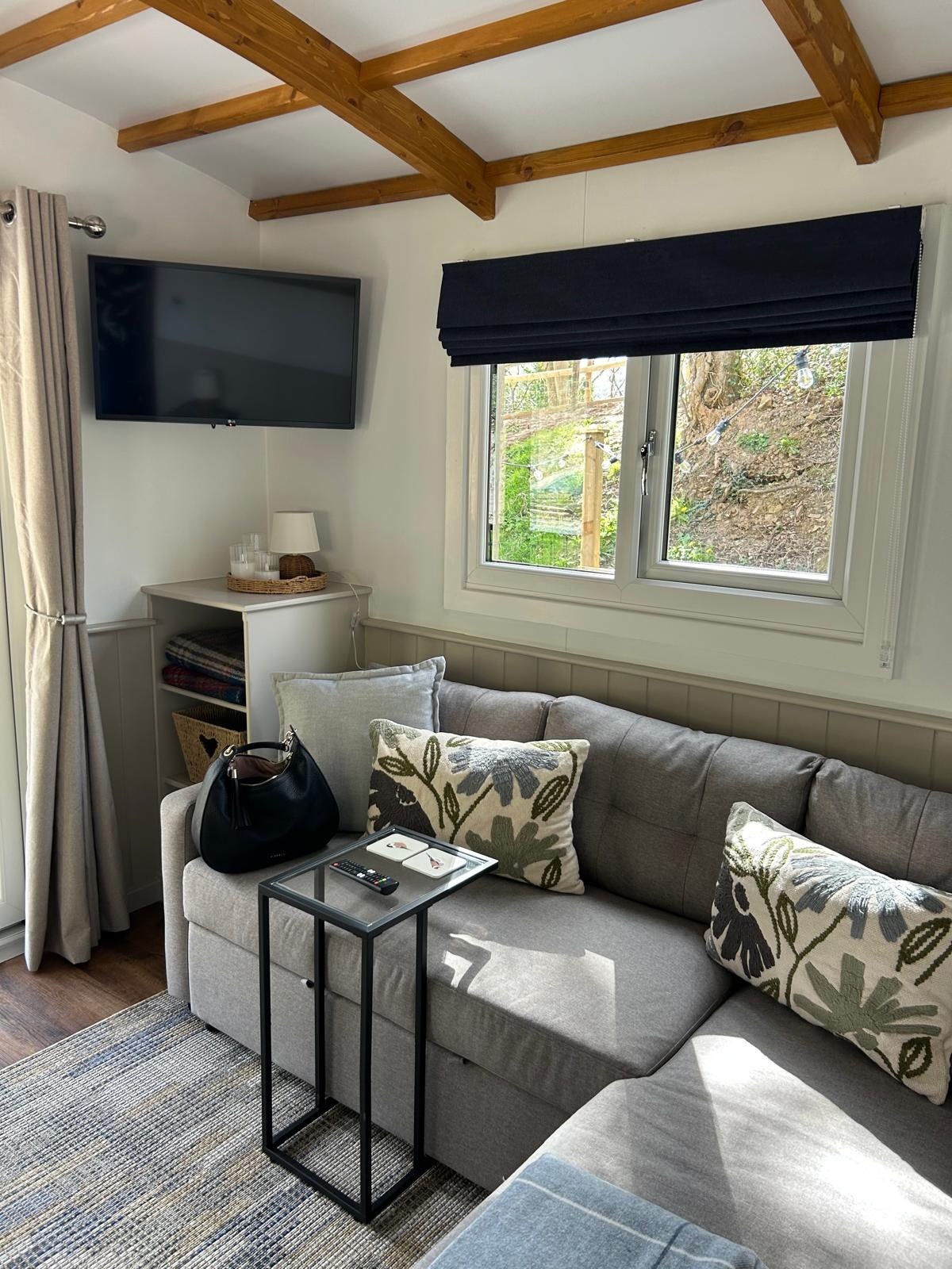 The light-filled lounge inside Sycamore Cabin