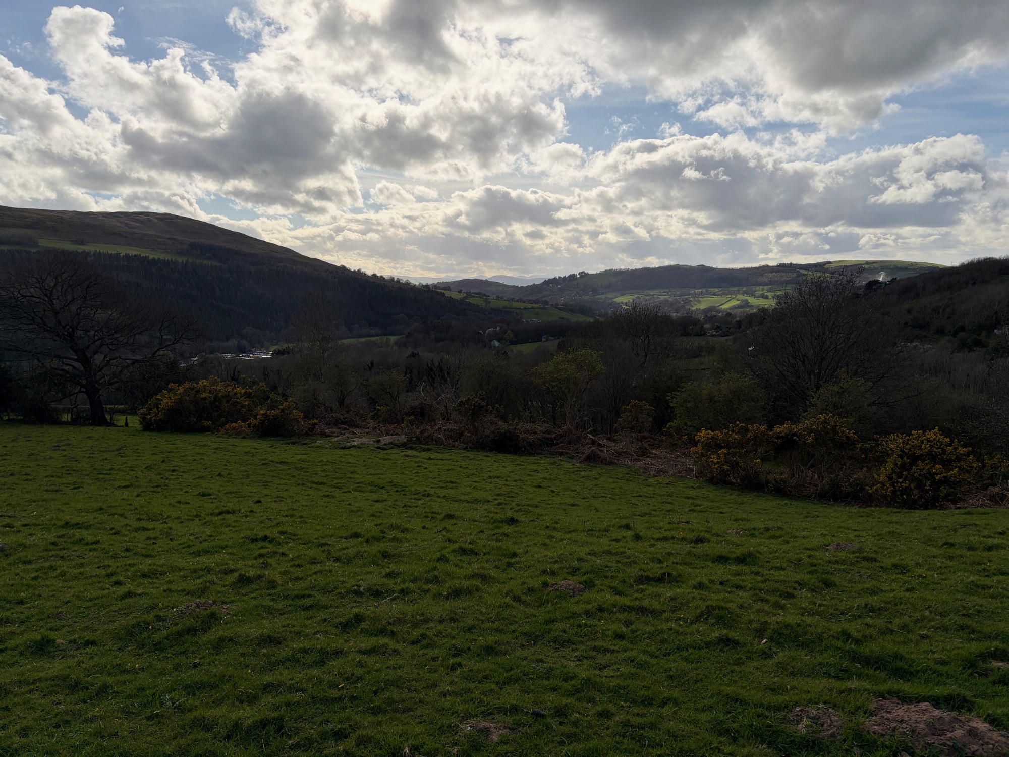 Wide green valley and hills near Wildwood Quarry in North Wales